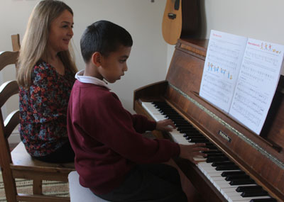 Nina Macpherson giving a piano lesson